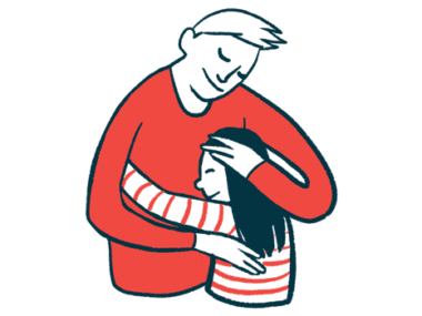 A man and a child share a hug.