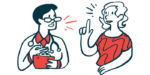 A woman speaks to a doctor, who is holding a chart.