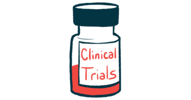 A medicine bottle, half full of liquid, is labeled clinical trials.