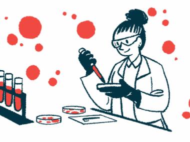 A scientist holds a dropper filled with red liquid over a petri dish near a rack containing vials.