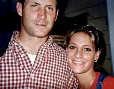 A photo on film from the late 1990s shows a man in a red-and-white checkered shirt and a young woman close together and smiling for the camera.
